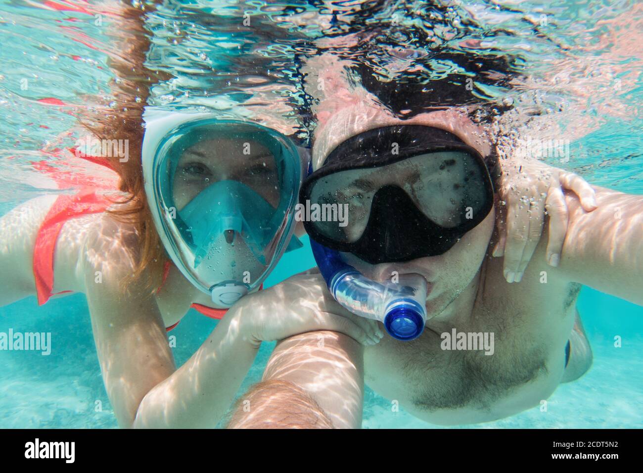 A couple in love taking selfie underwater in Indian Ocean, Maldives Stock Photo