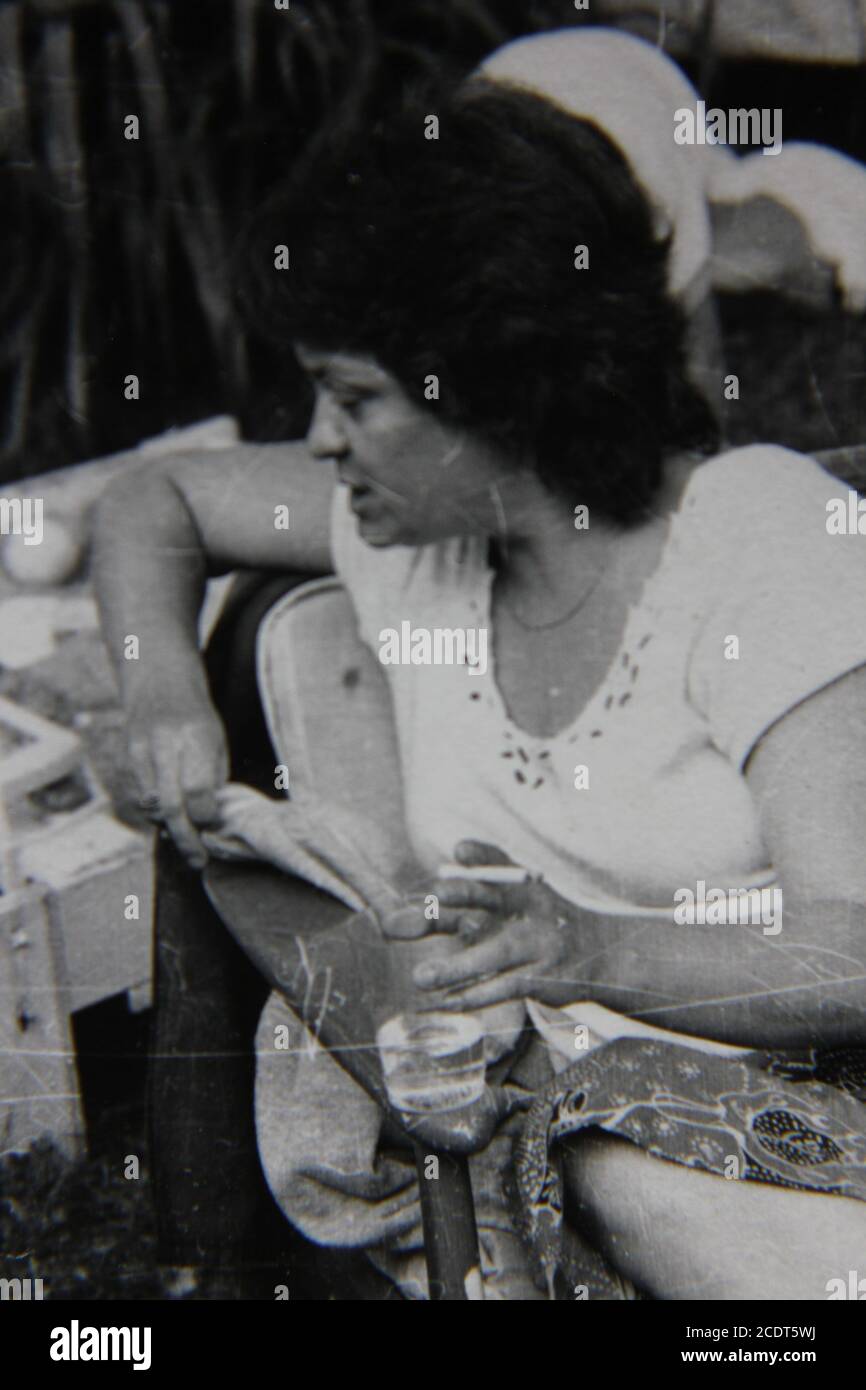 Fine 1970s vintage black and white photography of a woman smoking a ...