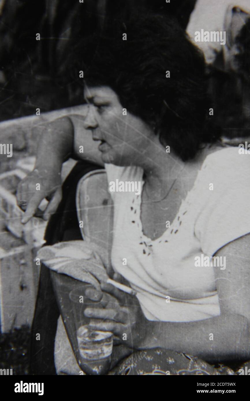Fine 1970s vintage black and white photography of a woman smoking a ...