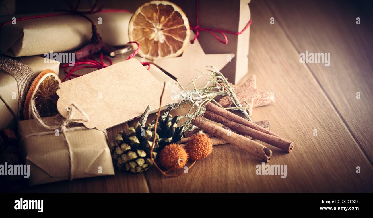 Rustic retro gift, present boxes with decorations. Christmas time, eco paper wrap. Stock Photo