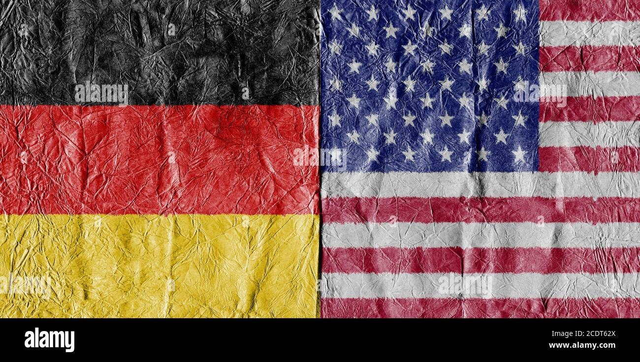 USA flag and Germany Flag on a paper in close-up Stock Photo