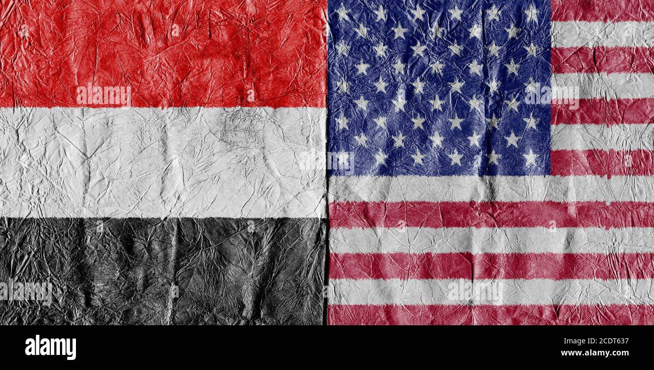 USA flag and Jemen Flag on a paper in close-up Stock Photo