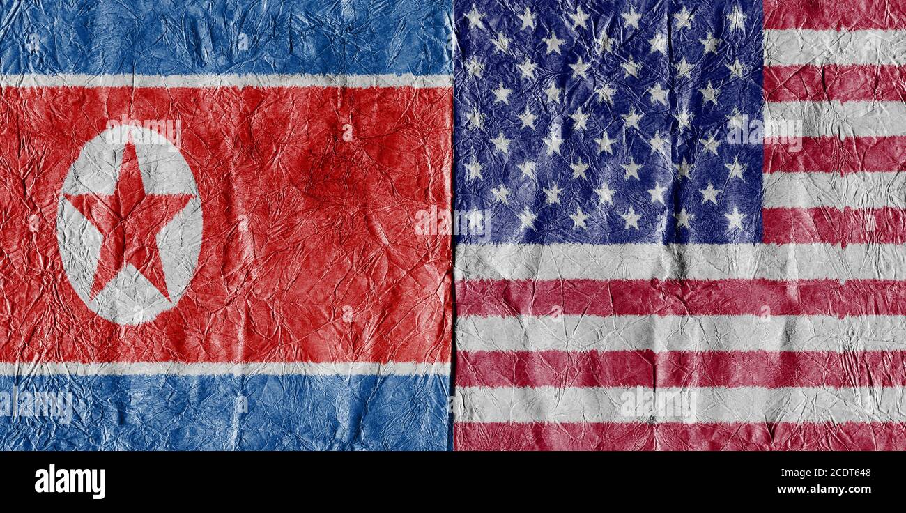 USA flag and North Korea Flag on a paper in close-up Stock Photo