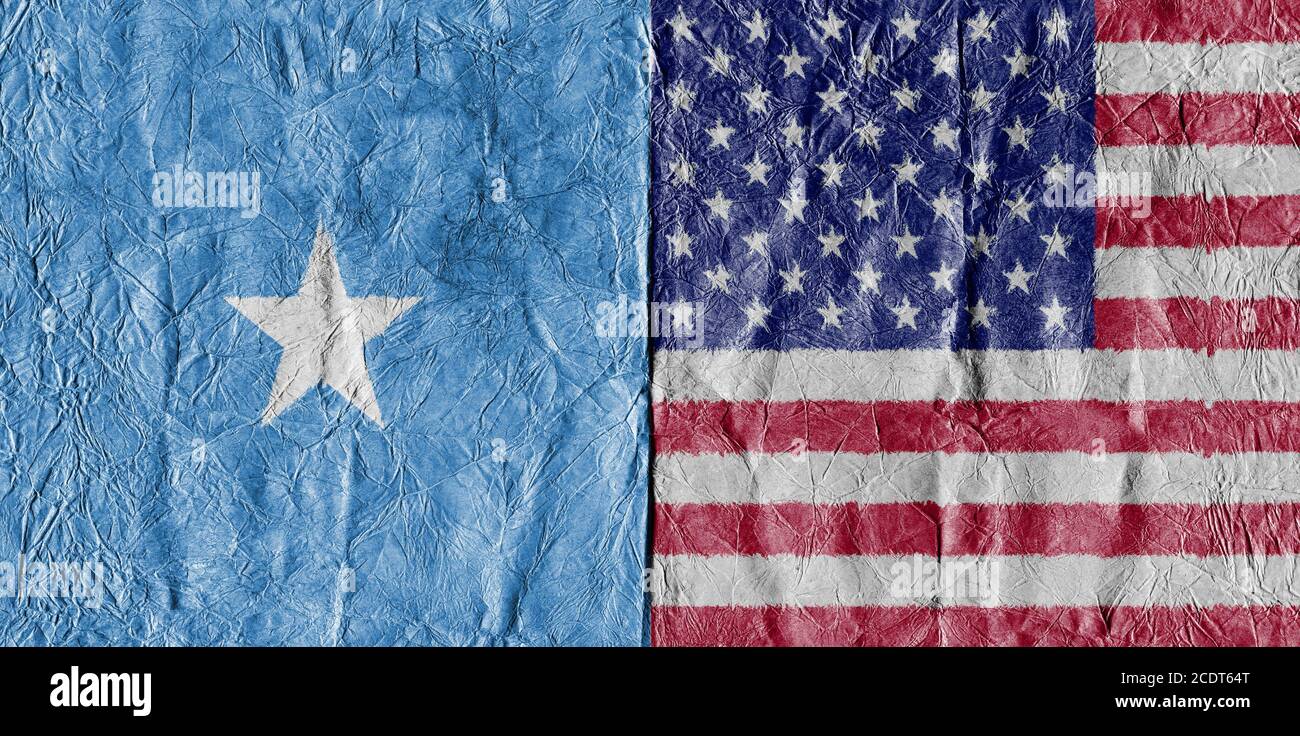 USA flag and Somalia Flag on a paper in close-up Stock Photo
