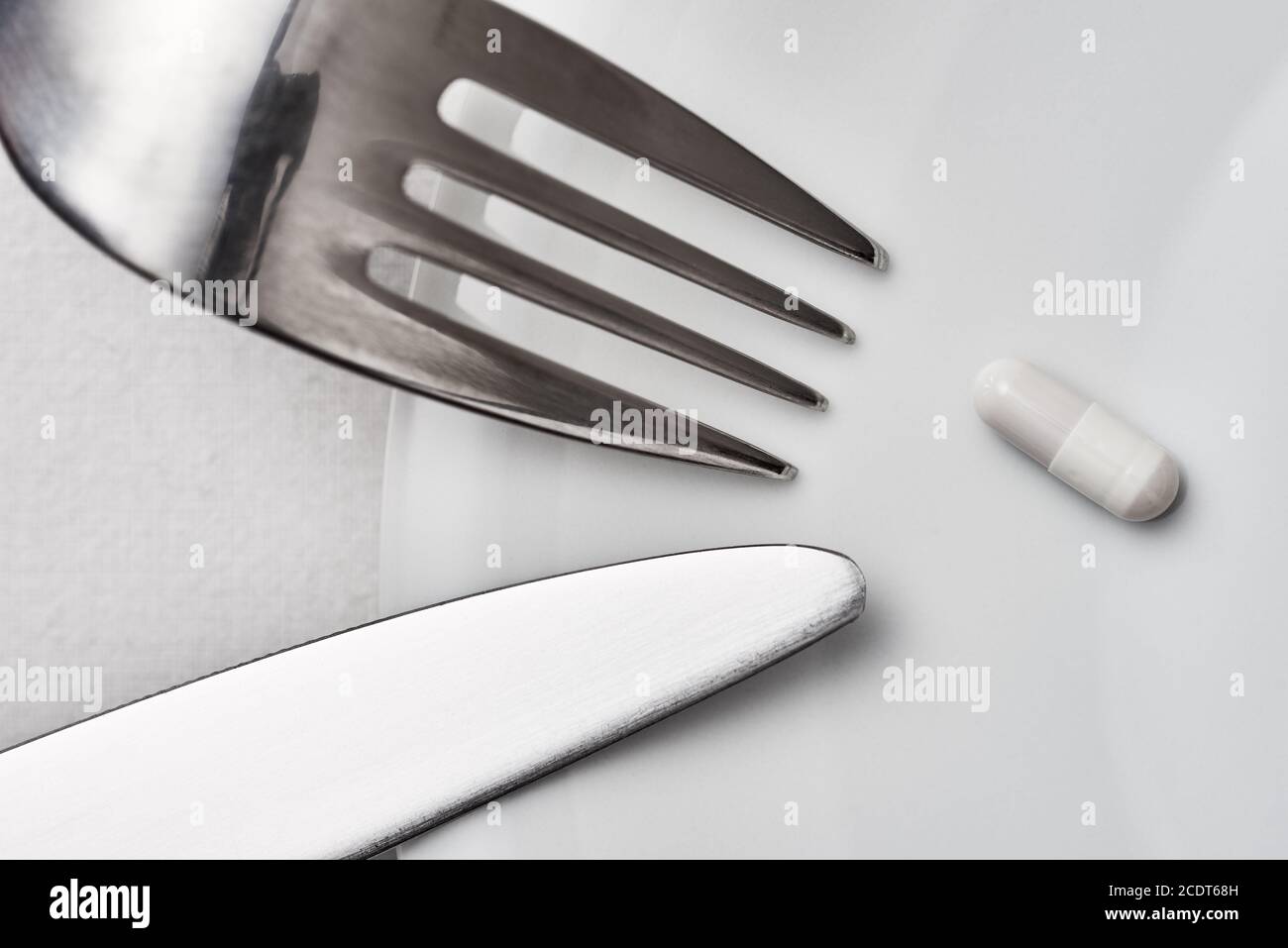 Knife, Fork, Capsule Stock Photo