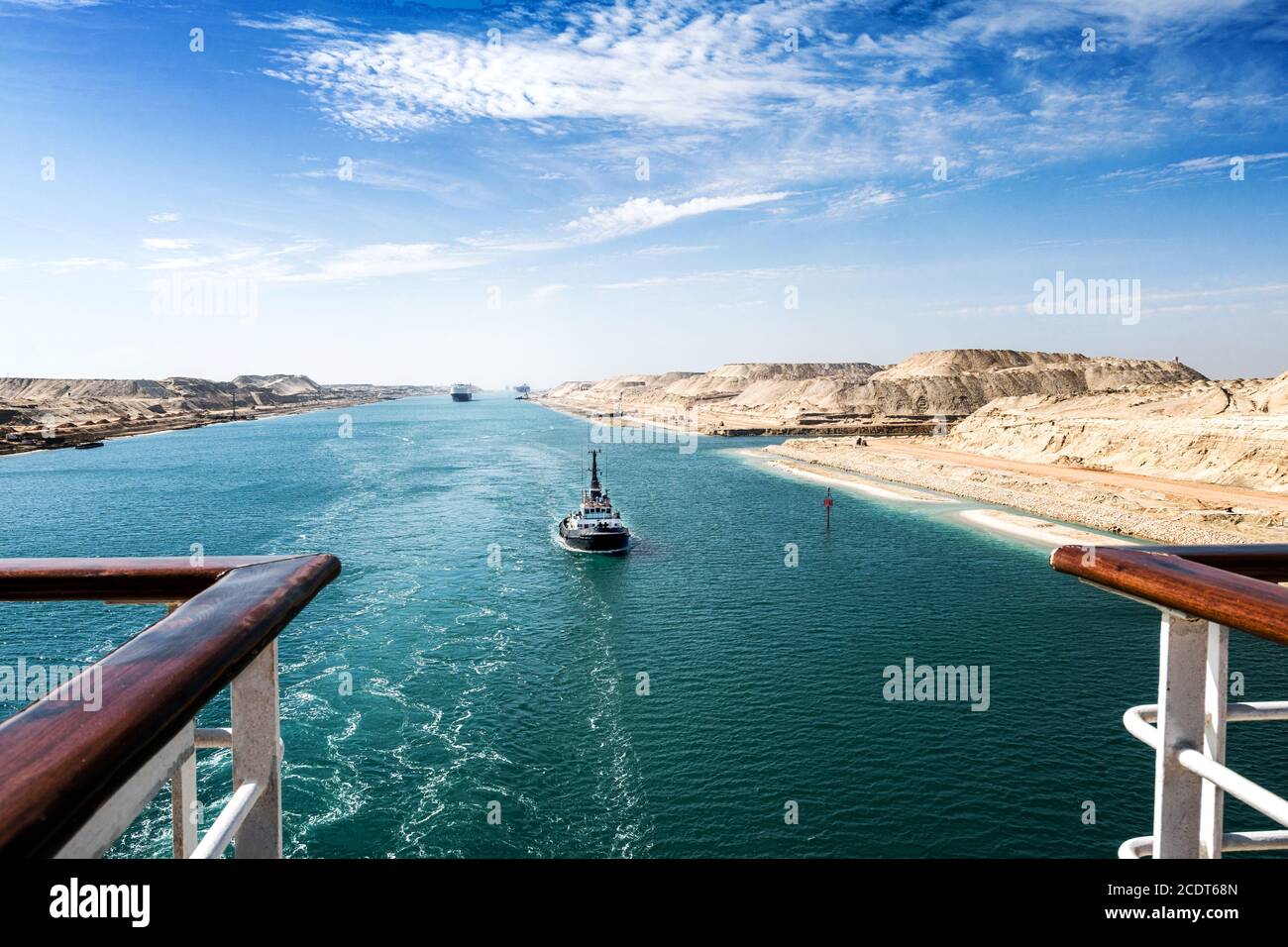 The Suez Canal - a ship convoy with a cruise ship passes through the new eastern extension canal Stock Photo