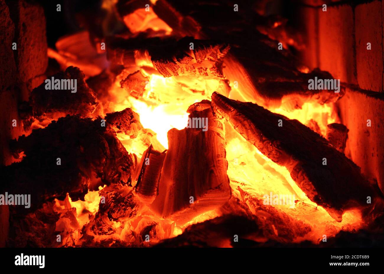 Burning wood, hot coals and fire in the fireplace Stock Photo Alamy