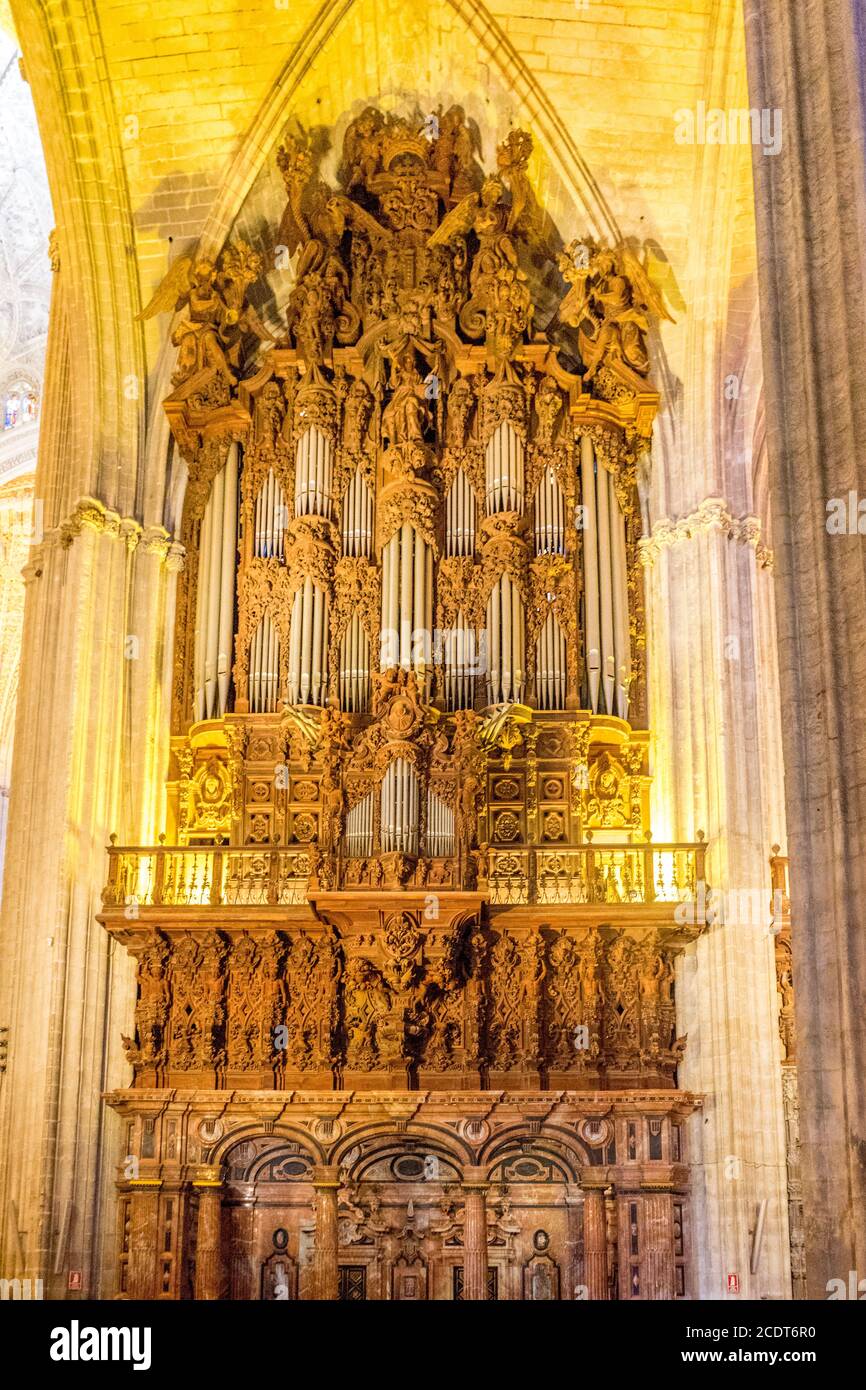 Pipe organ inside the Seville Cathedral and La Giralda (bell tower/minaret),a UNESCO World Heritage Site,Santa Cruz District Stock Photo
