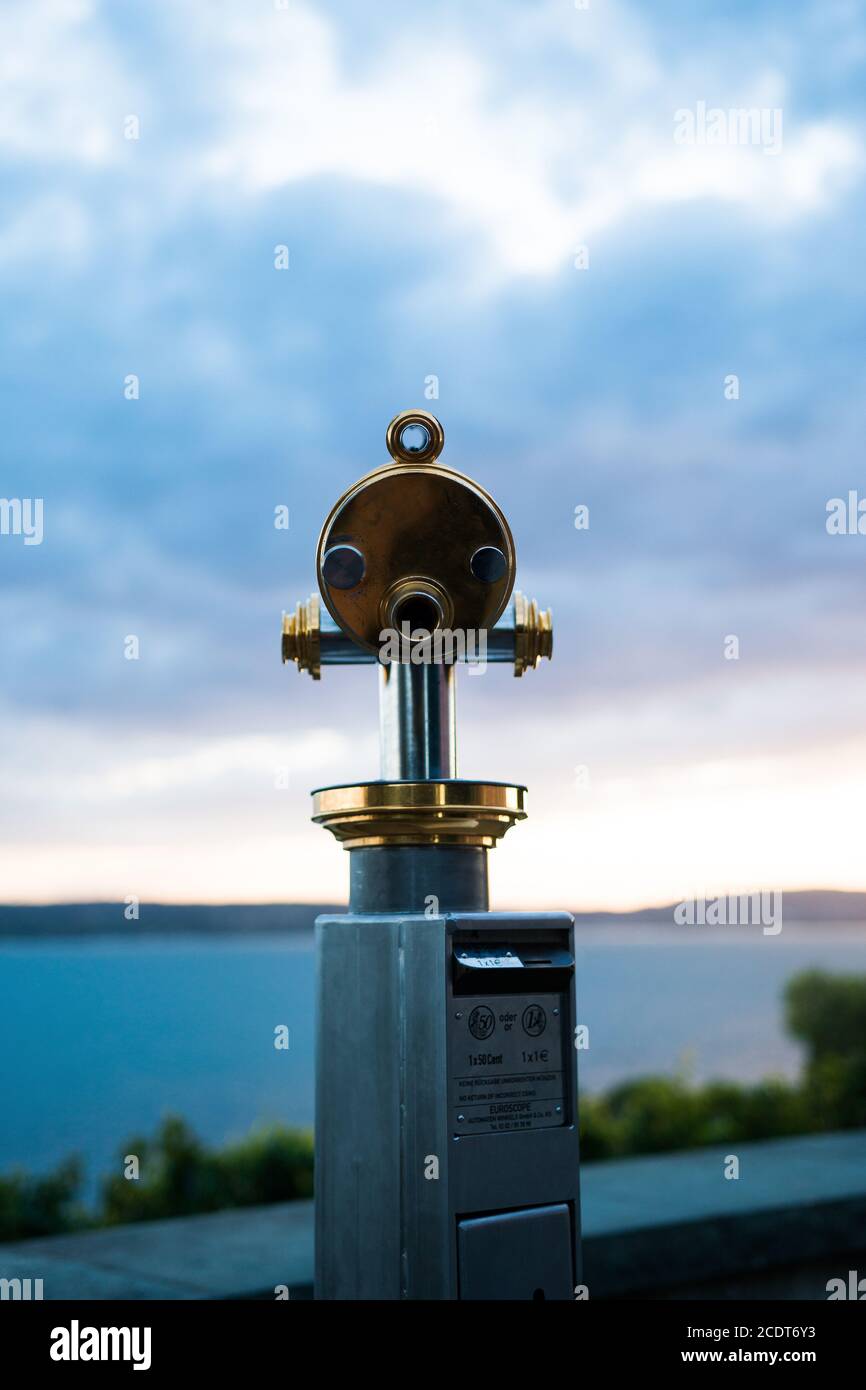 Public telescope at a lake... Stock Photo