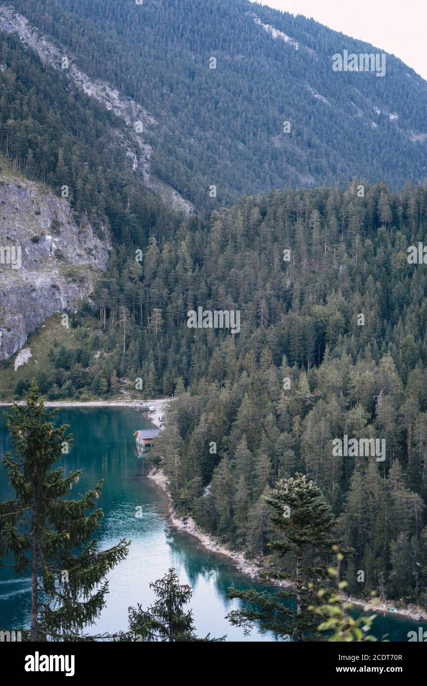 View landscape of forest and Blindsee is a lake on mountain of Tyrol, Austria for people looking and visit Stock Photo