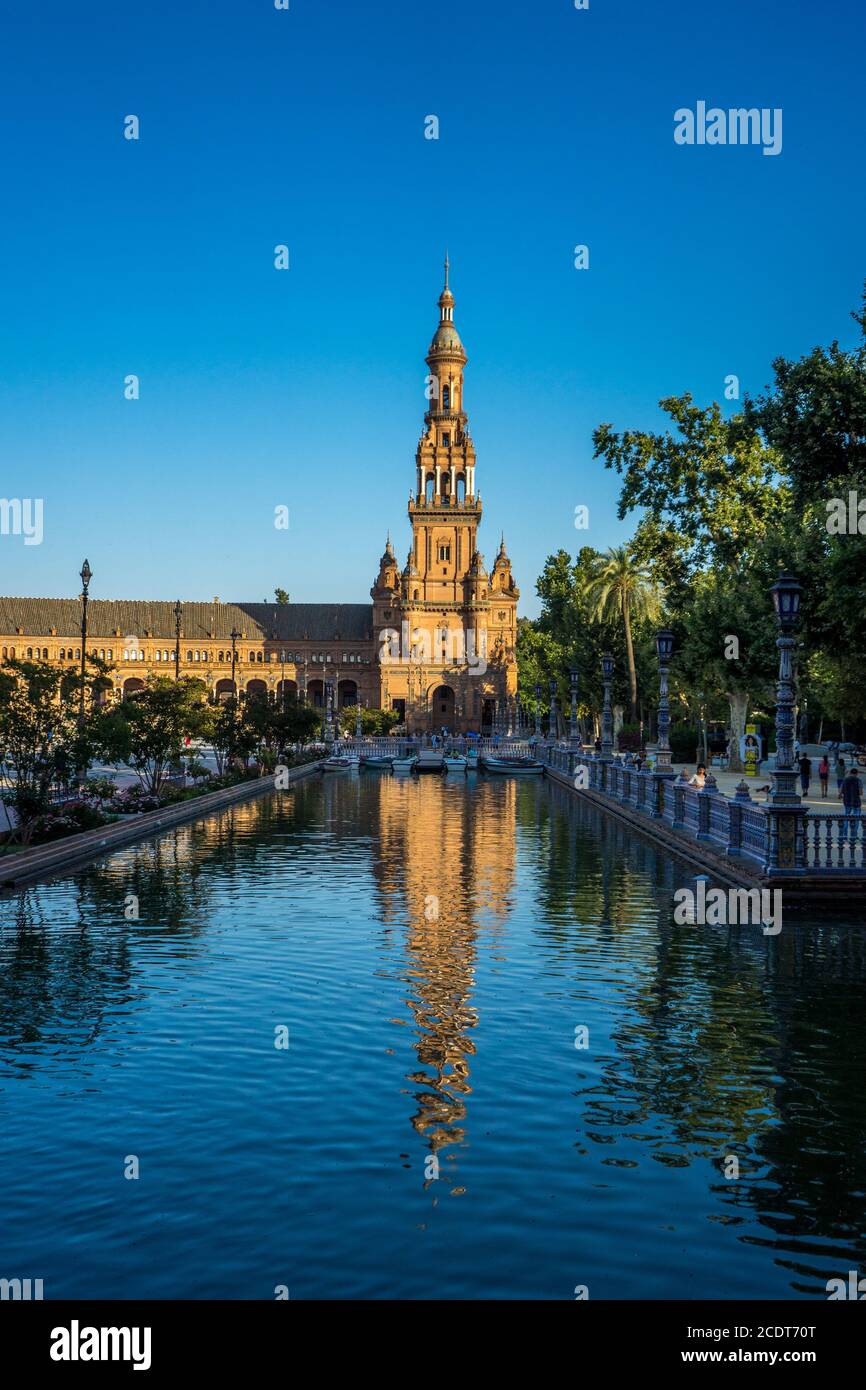 The tower in plaza de espana with reflection in water in Seville, Spain, Europe Stock Photo