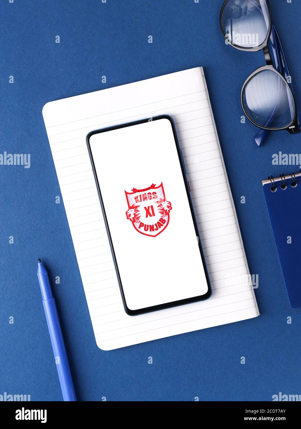 Assam, india - August 27, 2020 : Kings XI punjab logo on phone screen stock image. Stock Photo