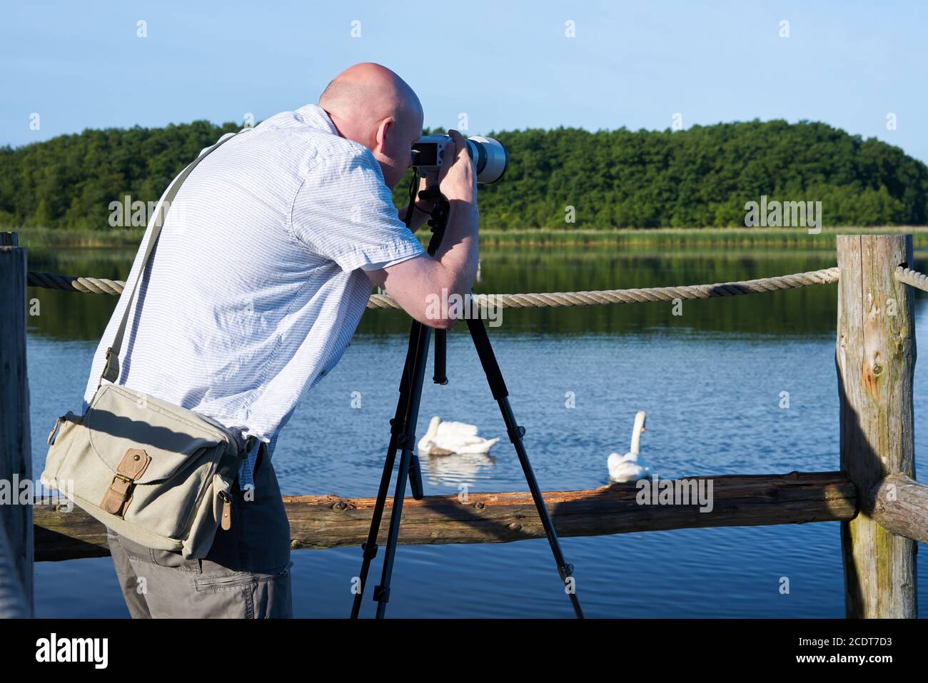 Photographer on a lake in the Mueritz National Park in Germany Stock Photo