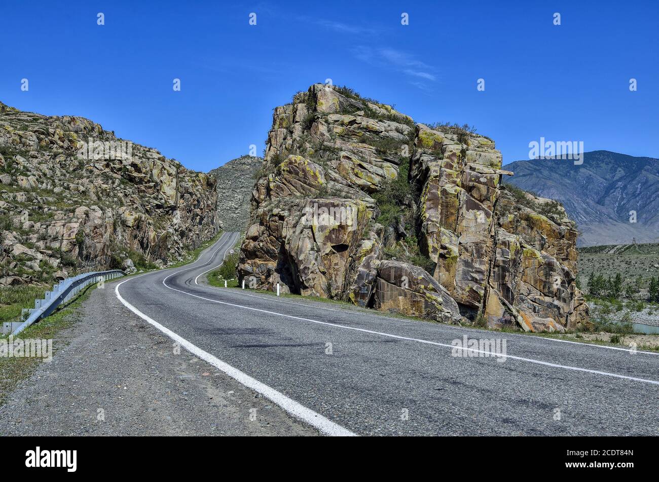 Mountain landscape - road paved in colorful rocks of Altai, Russia Stock Photo