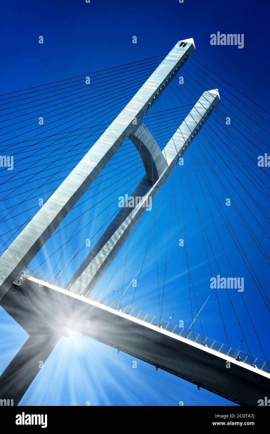 The Mubarak Peace Bridge near the city of  El-Qantara leading over the Suez Canal with sun reflex Stock Photo