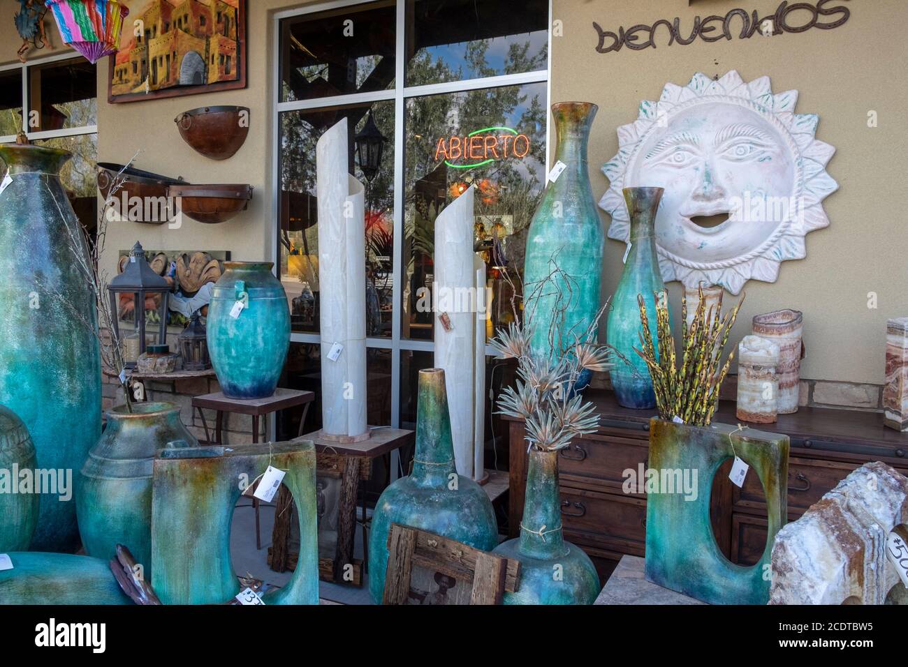 Turquoise glazed craft pottery for sale in Mexican store Stock Photo
