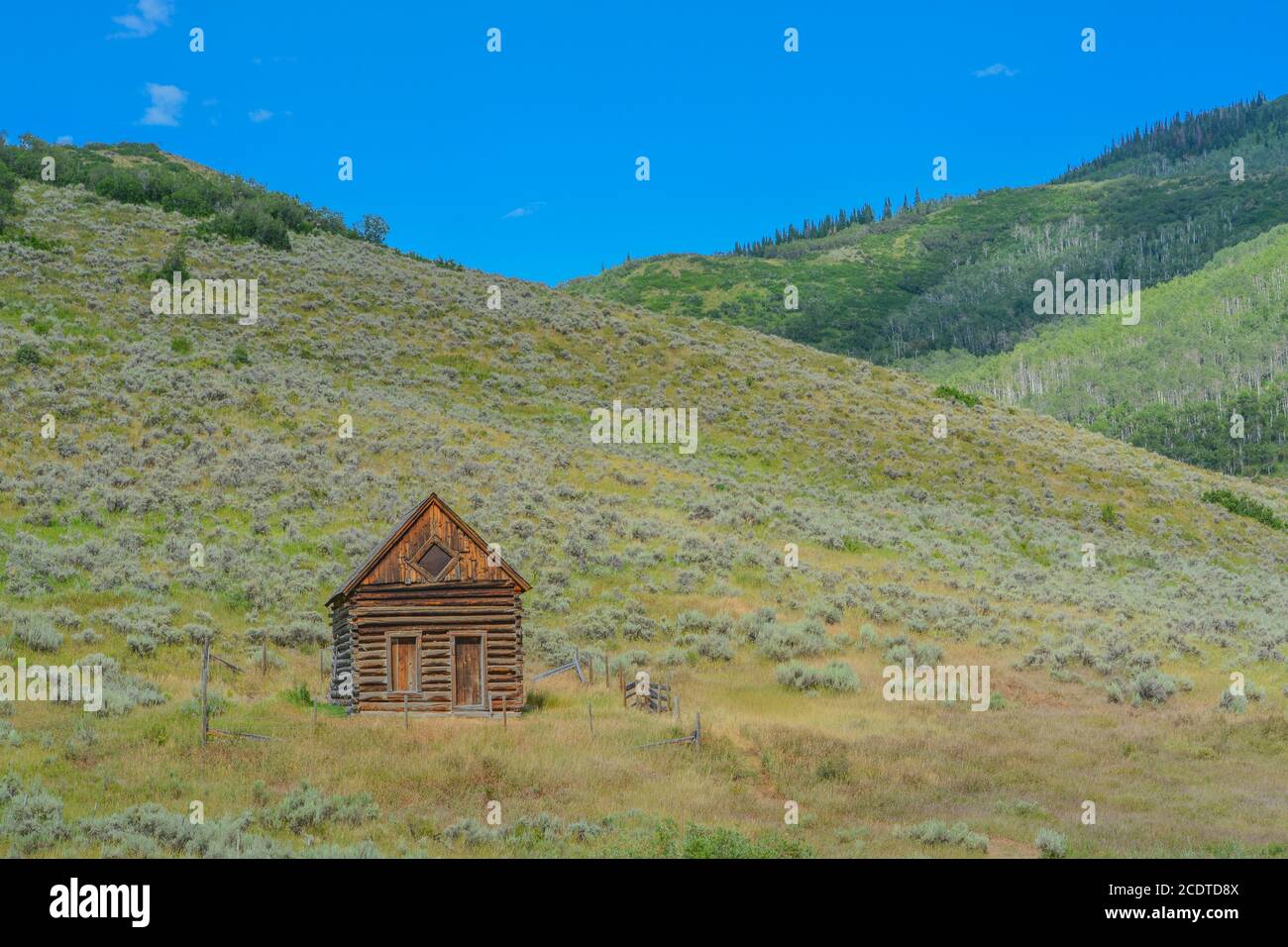 Old log cabin, abandoned in the country hillside of Rocky Mountains in