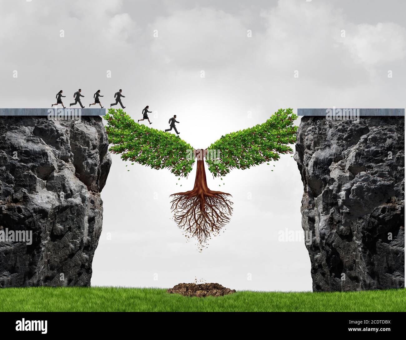 Overcome adversity as a business concept with a group of people running from one cliff to another with the help of a tree for bridging the gap. Stock Photo