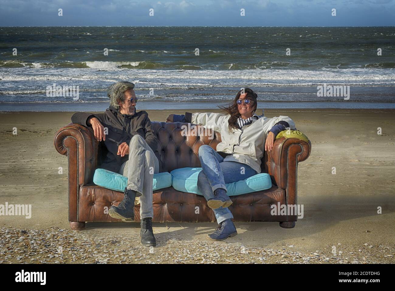 sitting on the beach Stock Photo