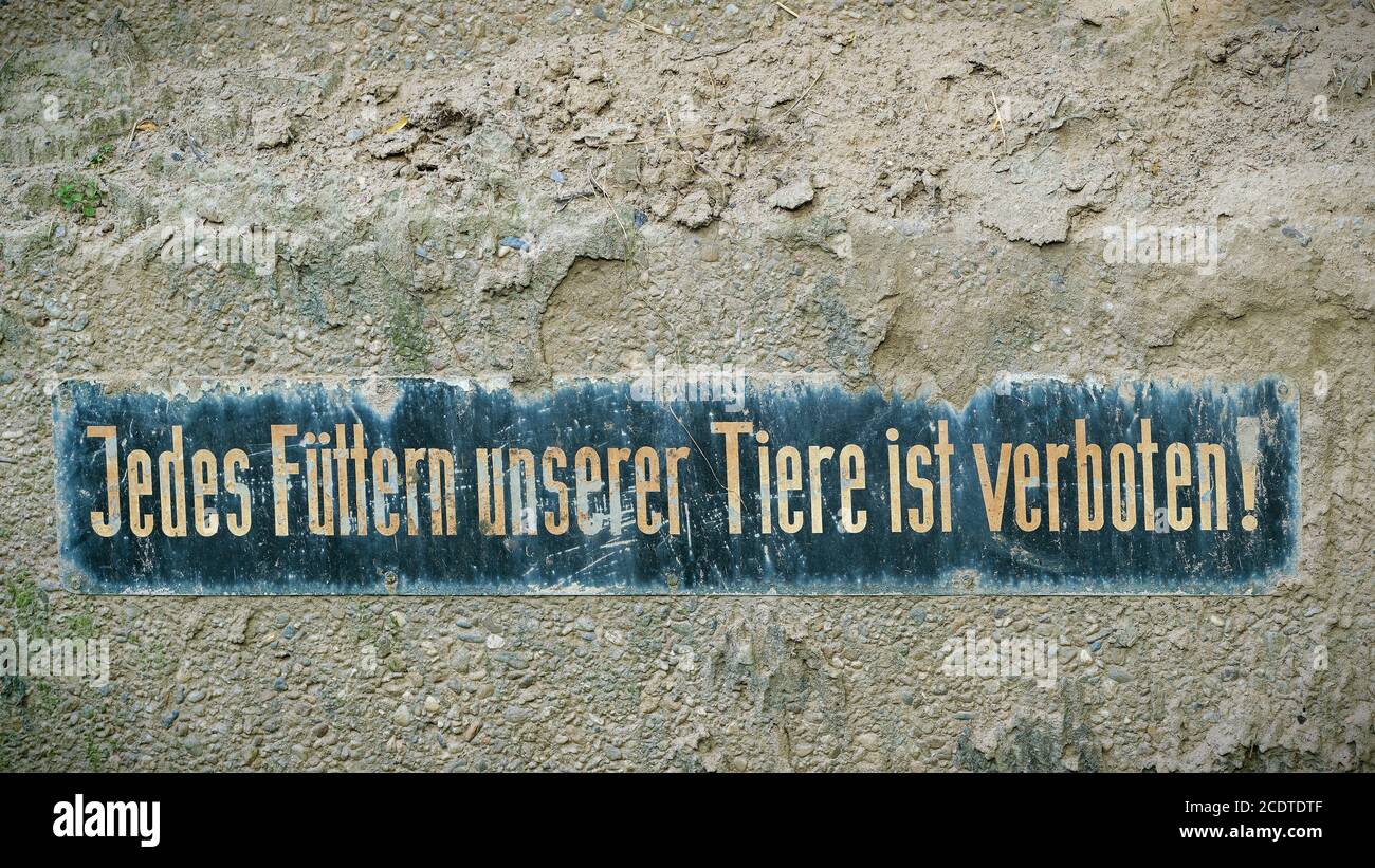 Sign in a zoo with the inscription every feeding of our animals is