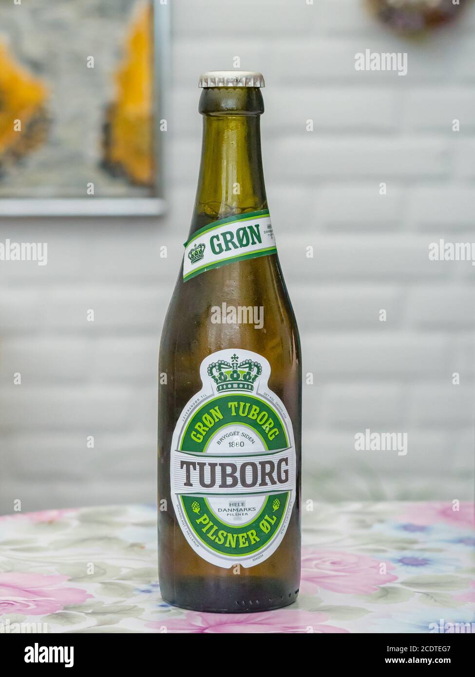 Tuborg Beer on a table on a cloudy summer afternoon Stock Photo