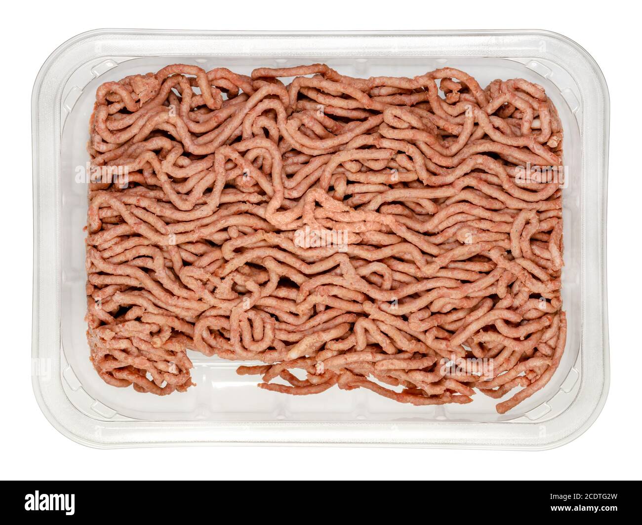 Vegan ground meat in a plastic tray. Substitute for minced meat based on pea protein, with onions and spices. Meat alternative. Close-up, from above. Stock Photo