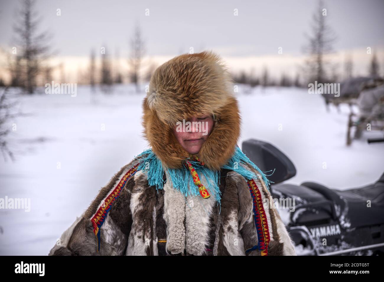 Nenet woman with traditional reindeer fur and hat, Yamalo-Nenets Autonomous Okrug, Russia Stock Photo