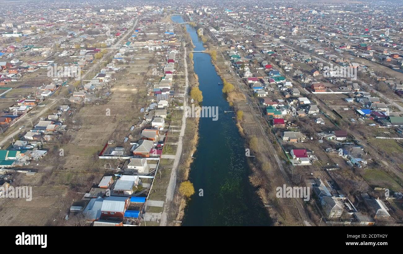 View from the top of the village. Streets without asphalt and single-storey houses. The Kuban village. Stock Photo