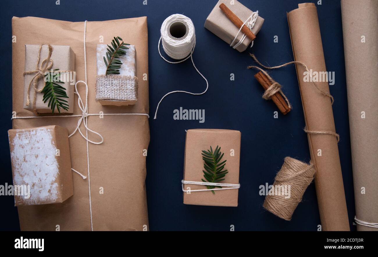 Christmas gifts and packaging materials on blue background Stock Photo