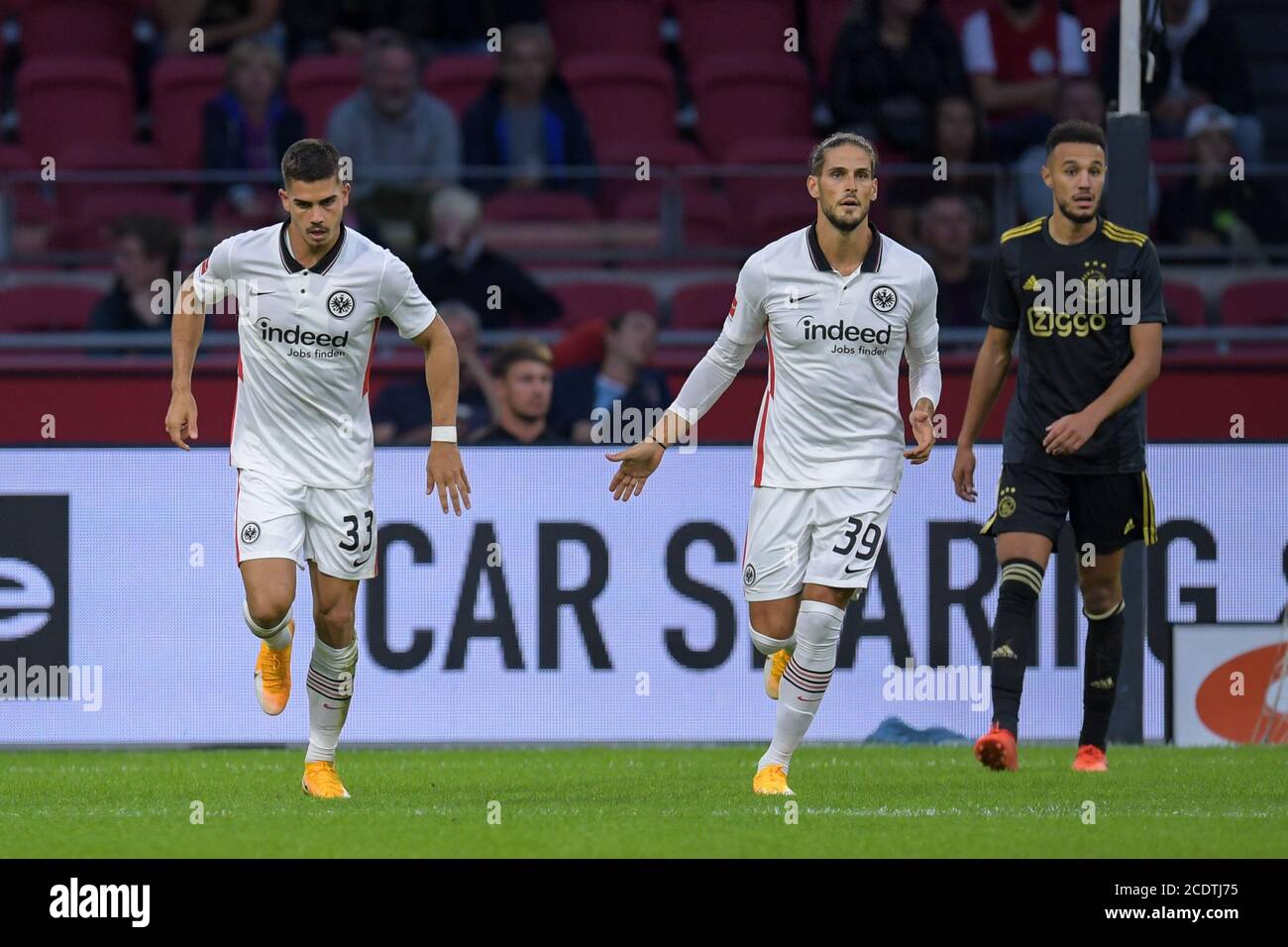 AMSTERDAM, NETHERLANDS - AUGUST 29: Andre Silva of Eintracht Frankfurt celebrating his goal with Goncalo Paciencia of Eintracht Frankfurt, Noussair Mazraoui of Ajax disappointed during the pre season match between Ajax and Eintracht Frankfurt on August 29, 2020 in Amsterdam, The Netherlands.   *** Local Caption *** Andre Silva, Goncalo Paciencia, Noussair Mazraoui Stock Photo