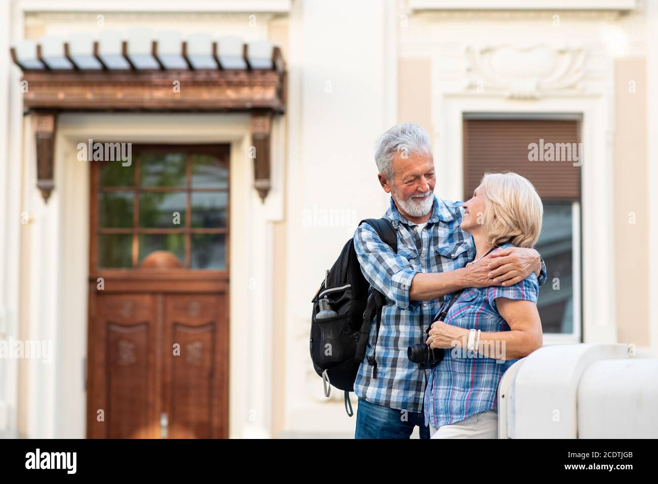 Happy senior couple of tourists in a city Stock Photo
