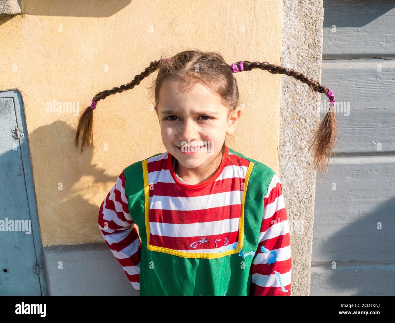 child dressed in carnival costumes on the outside to celebrate masquerade Stock Photo