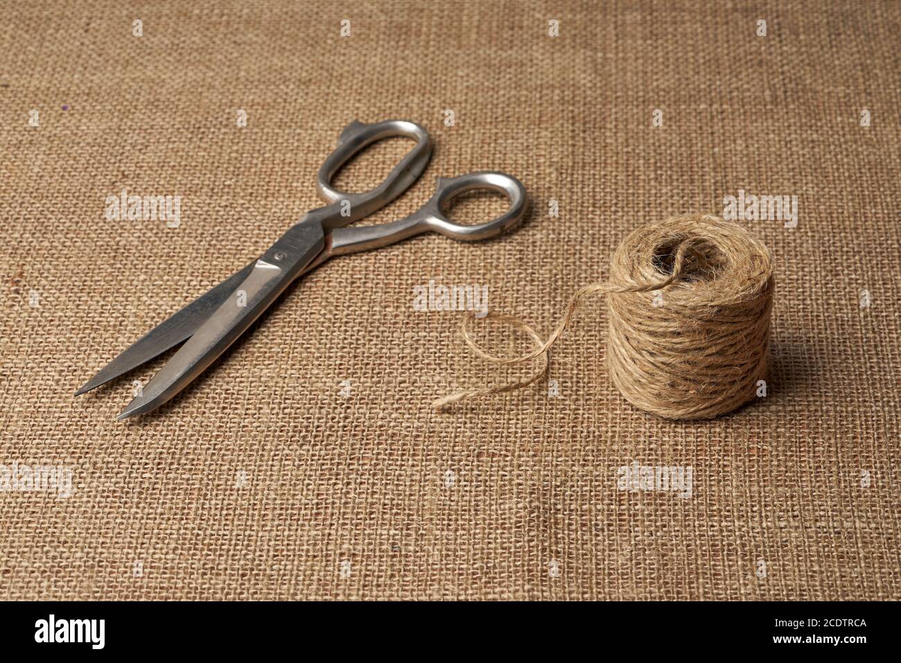 Ball of Brown String and Scissors on White Background Stock Photo - Alamy
