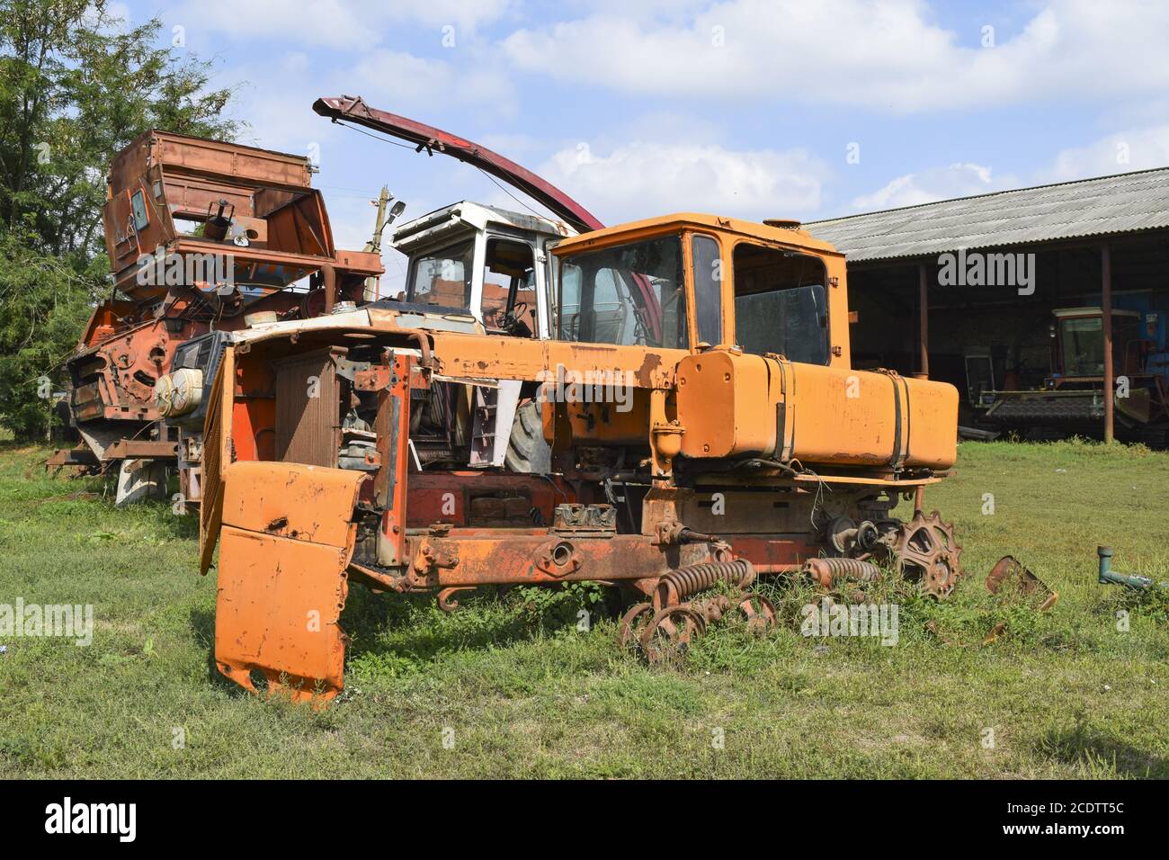 Old rusty disassembled tractor. Soviet agricultural machinery. Stock Photo