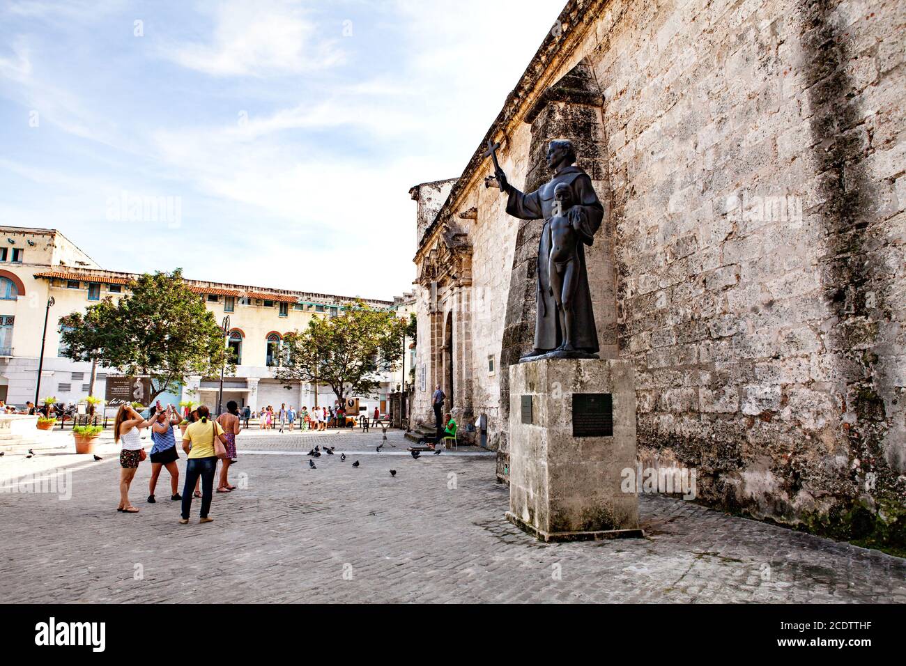 Tourists taking photos in front of the Statue of Fray Junipero Serra in Havana, Cuba Stock Photo