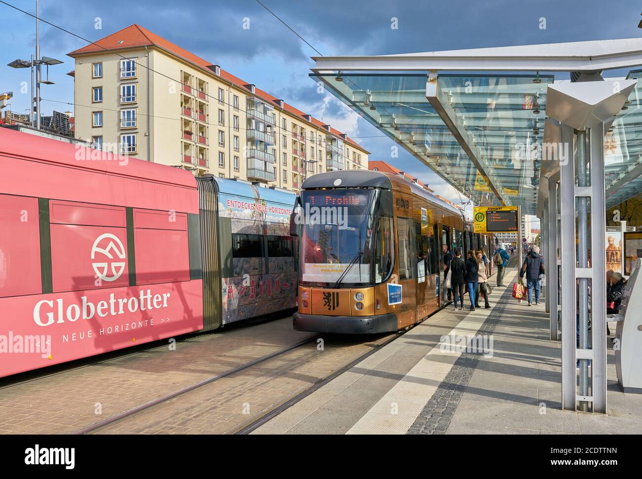 People at a tram stop in the busy city center of Dresden Stock Photo