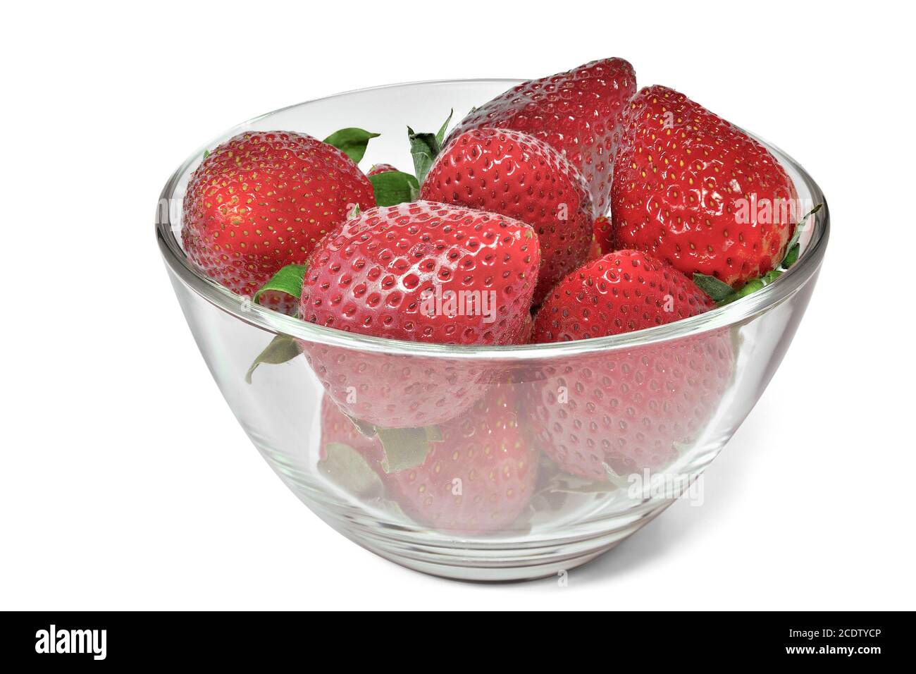 Ripe strawberry in glass bowl close up isolated on white background ...