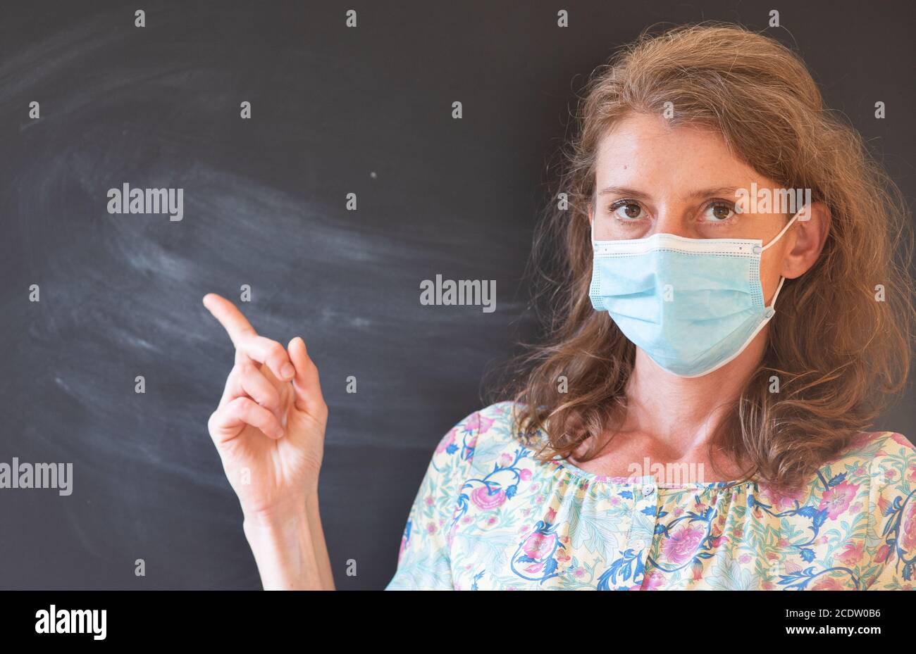 teacher wearing face mask back to school during covid pandemics Stock