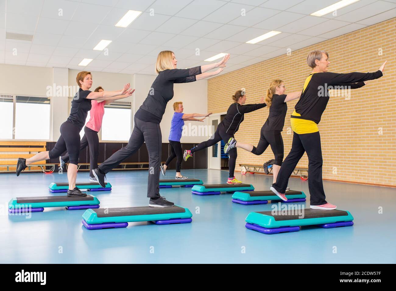 Caucasian dutch women group exercising in sports lessons Stock Photo