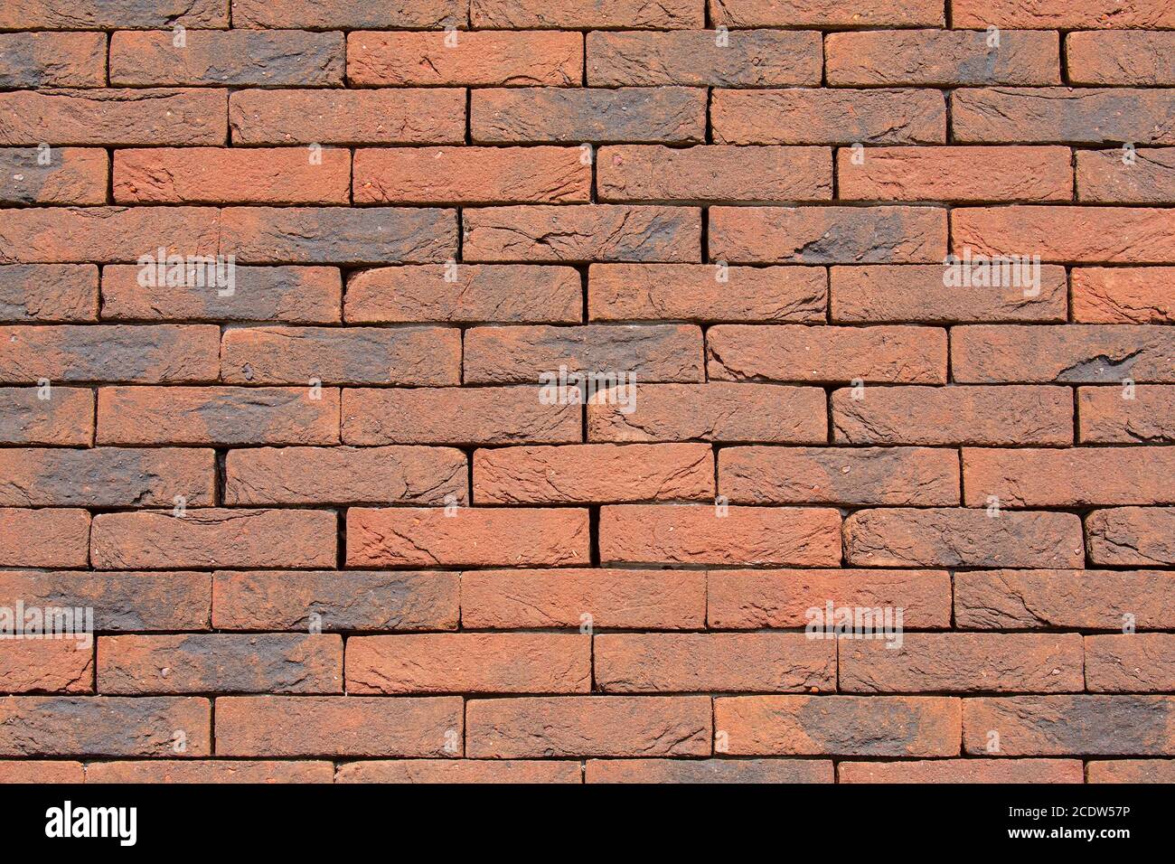 Background brick wall without cement joints Stock Photo