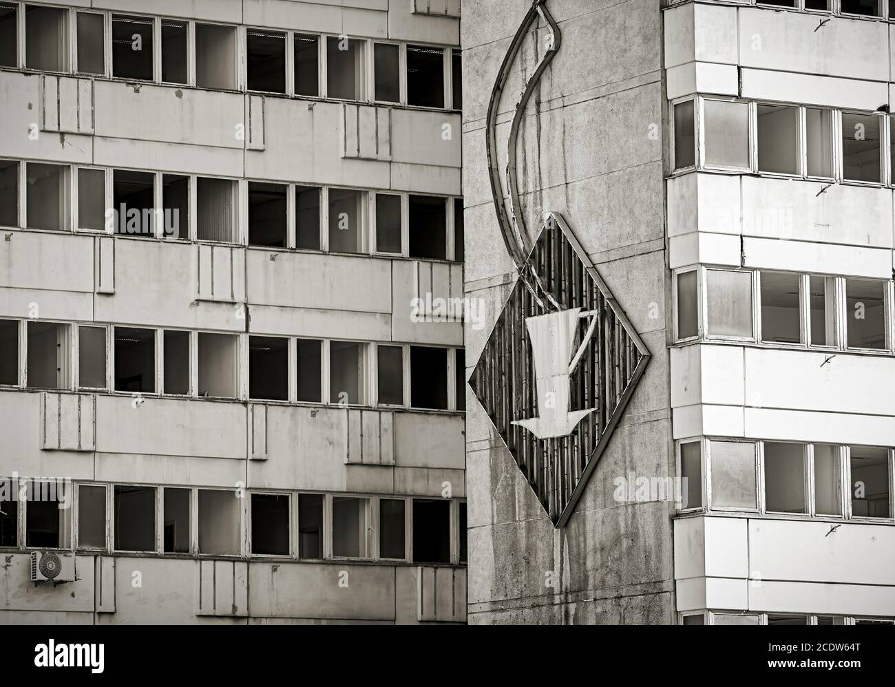broken GDR neon sign at an abandoned office building in Berlin Stock Photo