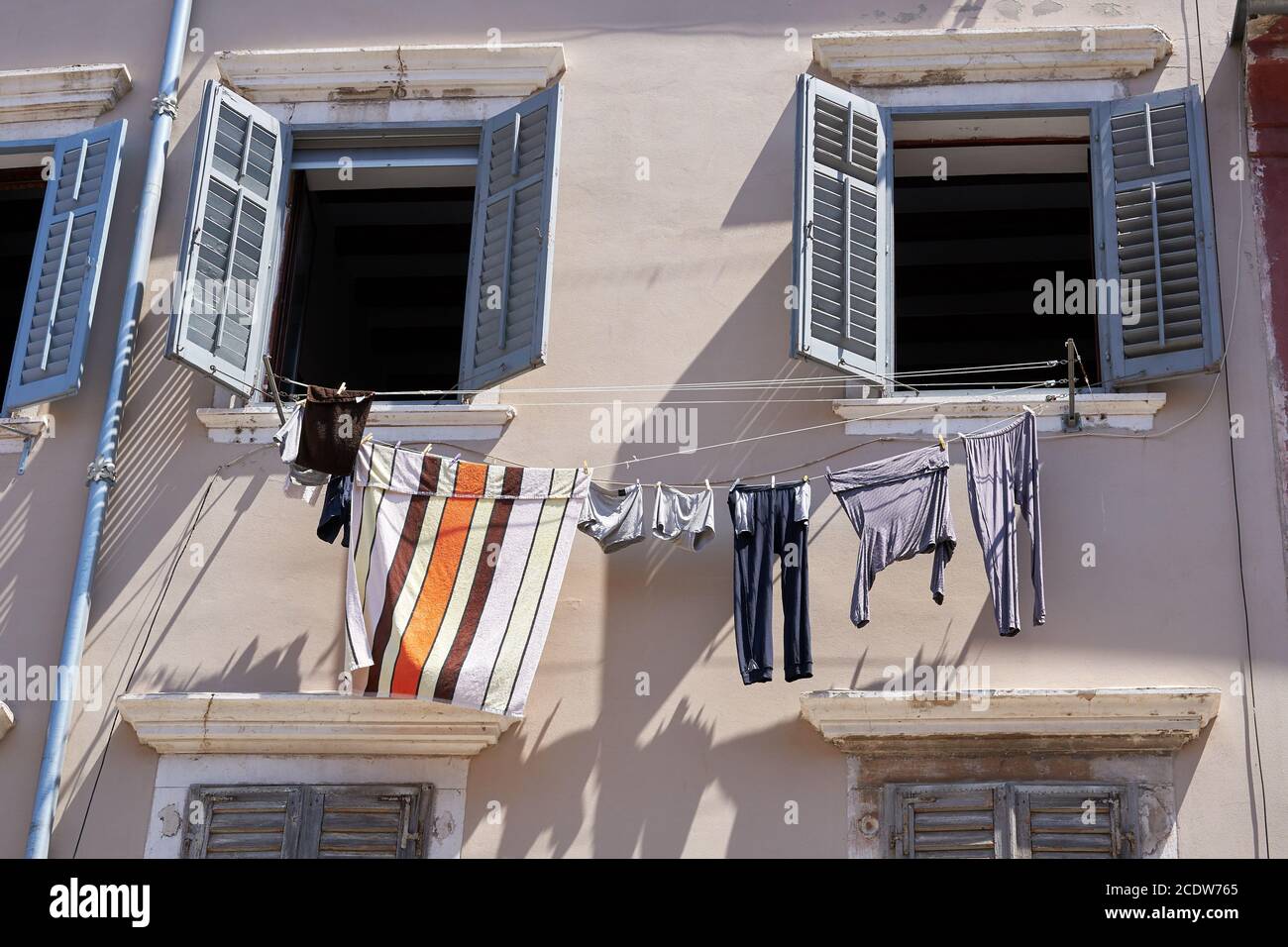 Historical building and clothesline in the old town of Rovinj in Croatia Stock Photo