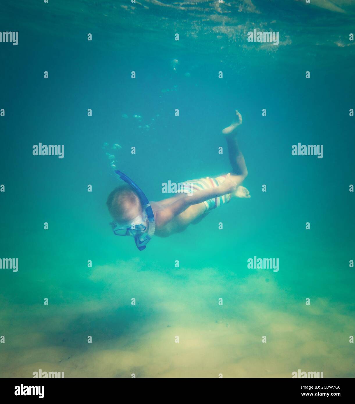 Kid boy diving underwater Stock Photo