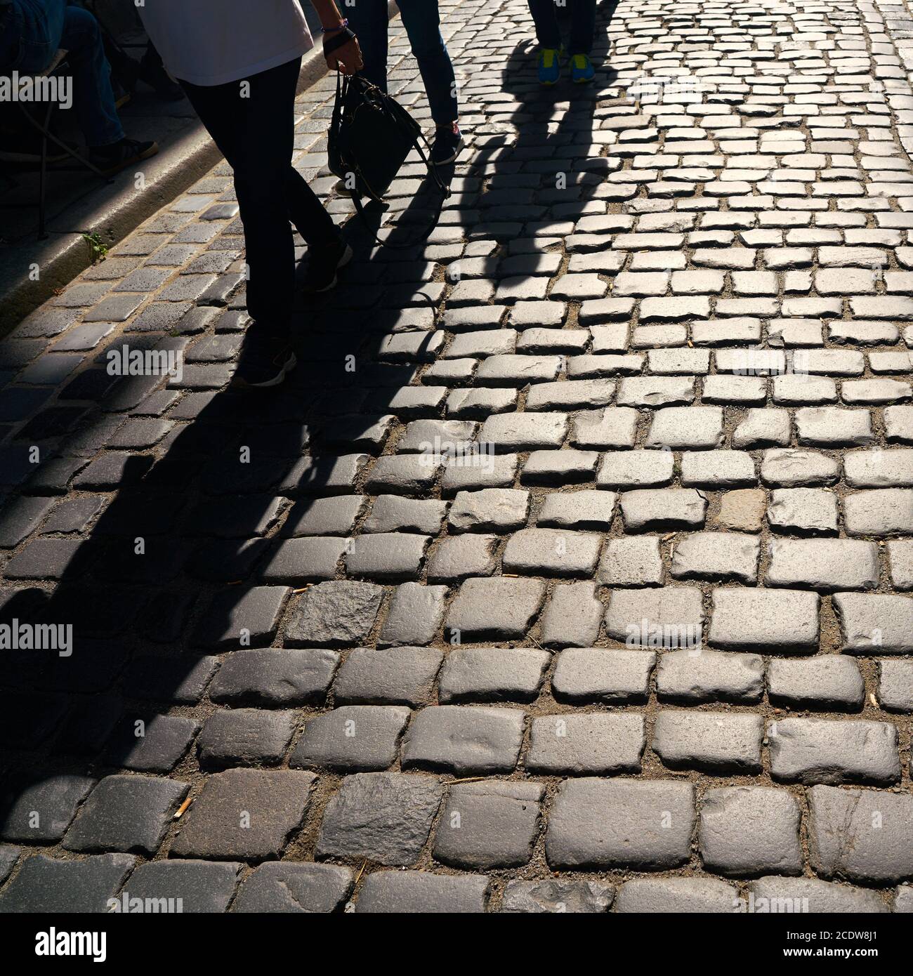 Shadow of oncoming pedestrians in the old town of Quedlinburg Stock Photo