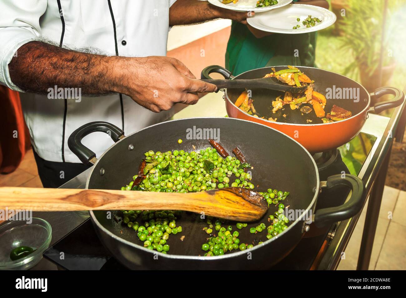 Chef at a cooking demonstration of Indian Ayurvedic cuisine Stock Photo