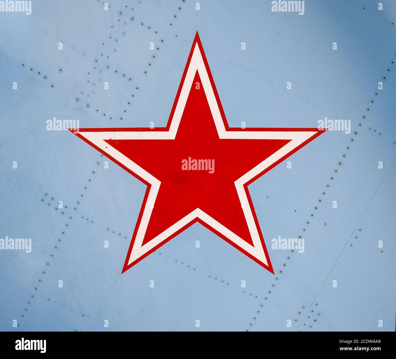 Five-pointed red star on the wing skin of a military fighter Stock Photo