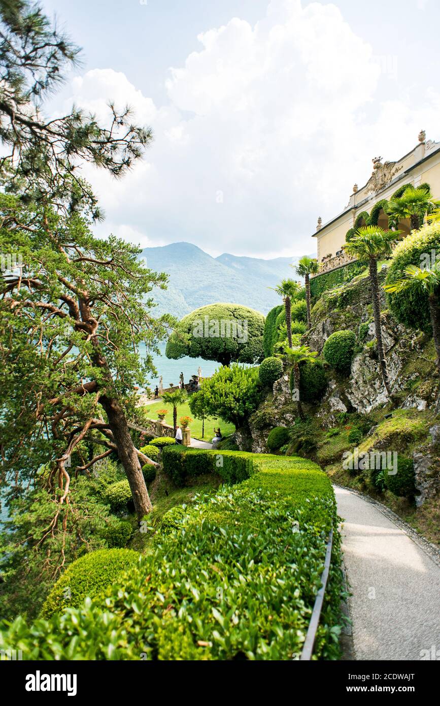 Villa Balbianello. Lake Como. Italy - July 19, 2019: Footpath Following to Famous Tree in Garden at Villa del Balbianello on Lake Como. Italy. Stock Photo