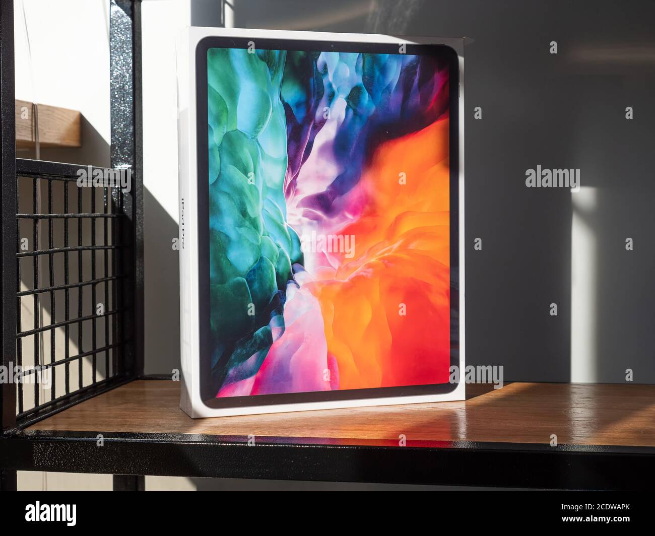 Penza. Russia - August 20, 2020: Packed Apple iPad Pro 2020. Diagonal 12.9 Inches. Tablet Computer on a Wooden Shelf. Stock Photo