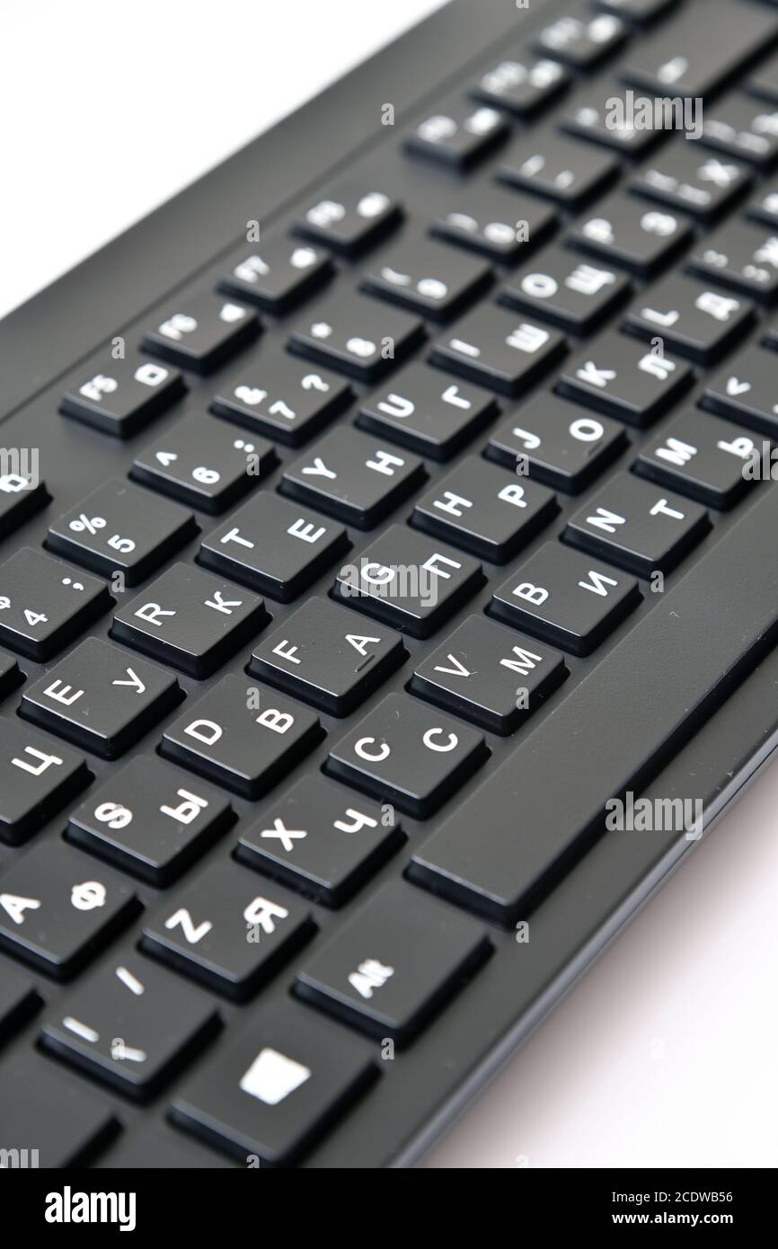 black wireless keyboard with Russian and English letters Stock Photo