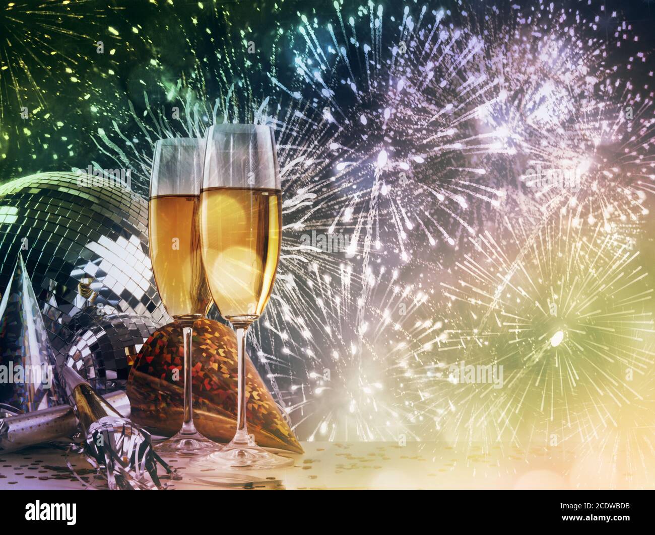 Two champagne glasses against New Year celebrations Stock Photo